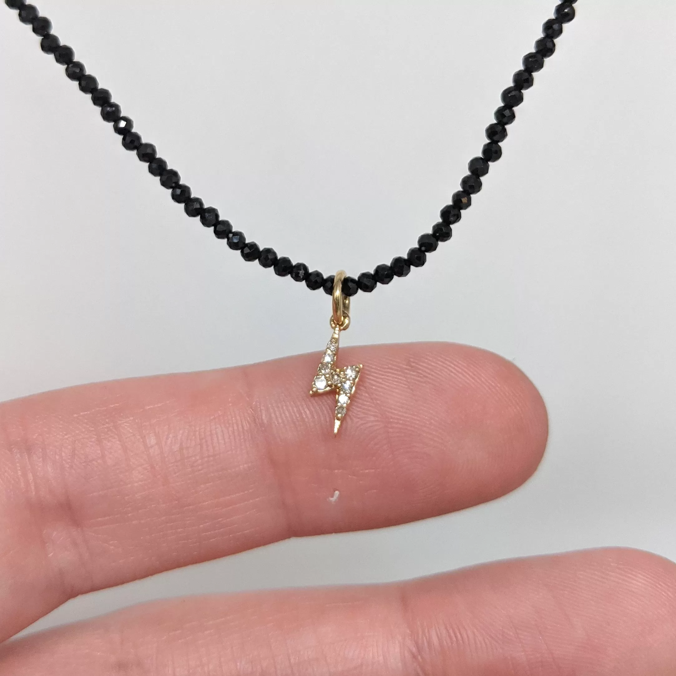 Diamond & 14kt Lightening Bolt Charm on Beaded Black Spinel Necklace by Margaret Solow