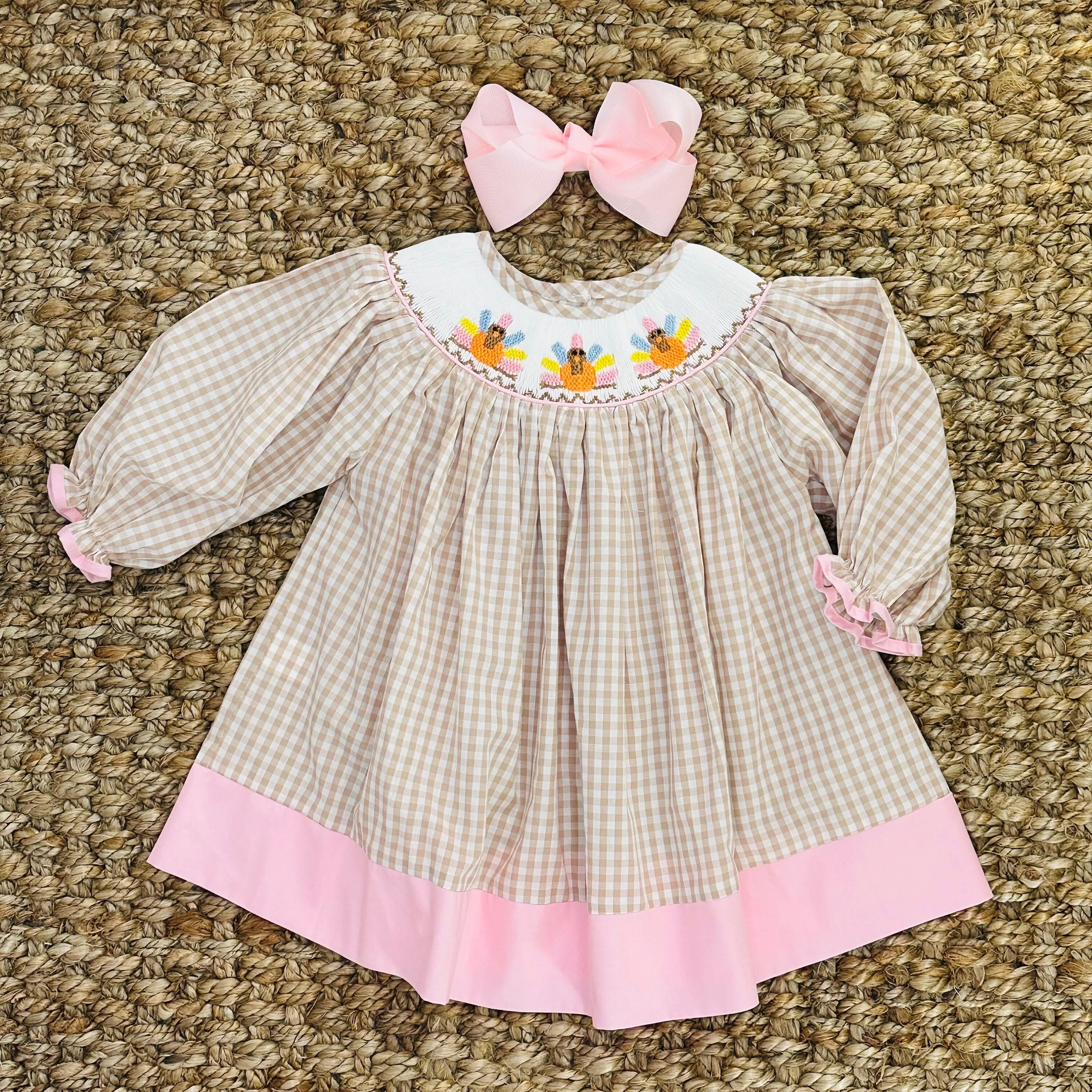 Smocked Turkey Bishop Dress in Tan and Pink!